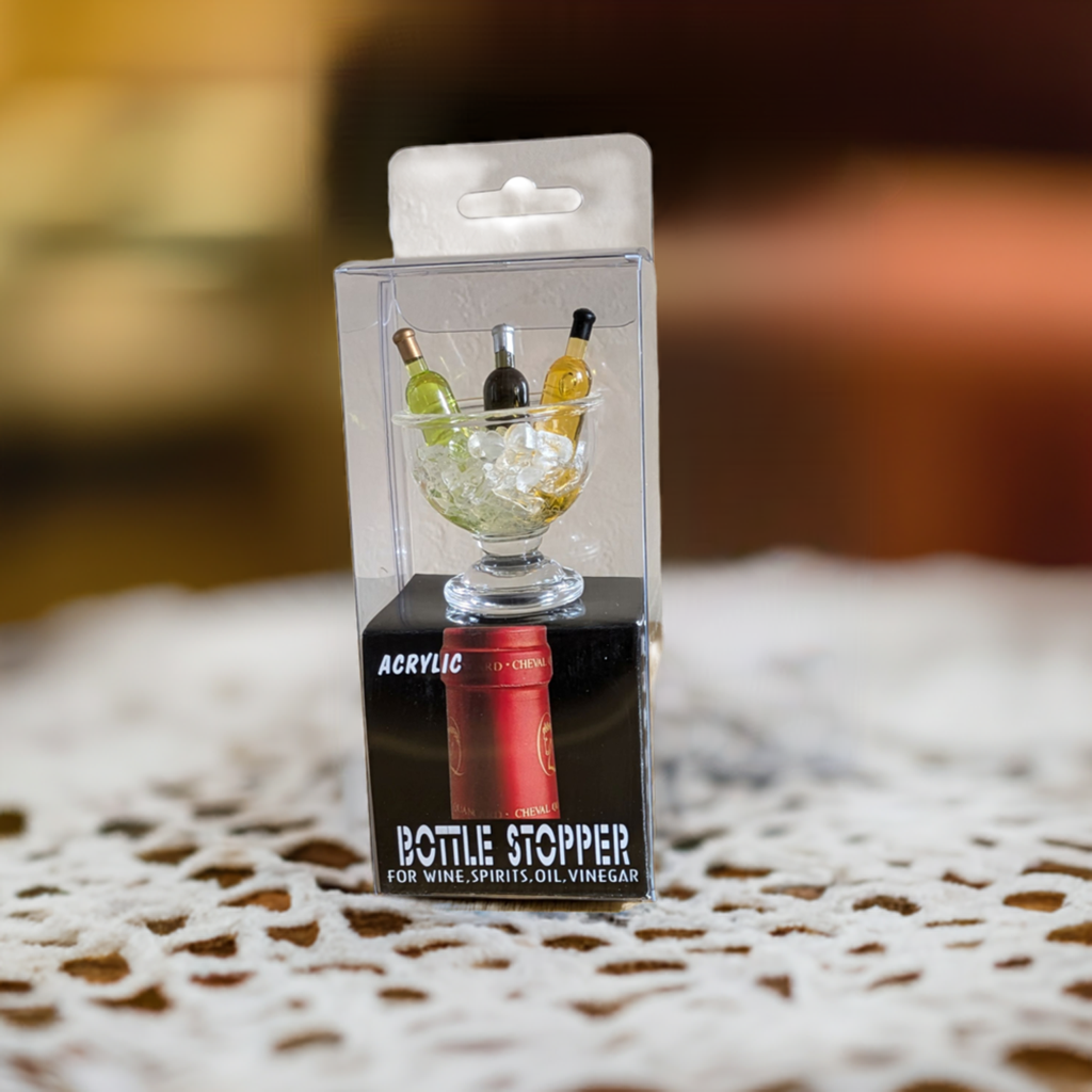 Un cadeau qui comprend du LaCoste (vin blanc parfumé du sud de la France) et 2 accessoires.